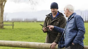 On the farm looking at a tablet