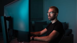 business analyst looking at a computer screen at a desk