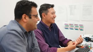 Happy Employees looking at computer