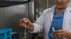 Woman testing milk samples 